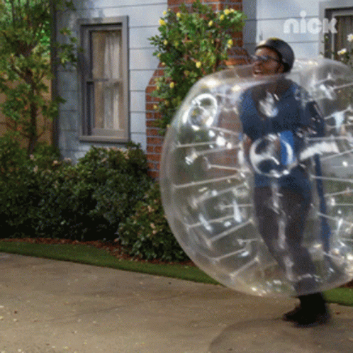 A Person In A Clear Bubble With A Nick Logo On The Bottom GIF