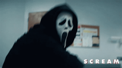 A Person In A Hooded Mask With The Word Scream On The Bottom Right GIF
