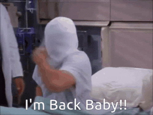 A Person In A Hospital Bed With A Blanket Over Their Head Says I 'M Back Baby GIF