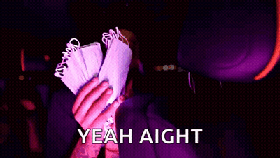 A Person In A Purple Hoodie Is Holding A Bunch Of Money And Says Yeah Aight . GIF