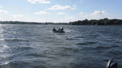 A Person In A Raft Is Floating On A Body Of Water GIF