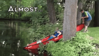A Person In A Red Kayak Is Being Pulled Out Of The Water By A Tree With The Words " Almost " Above It GIF