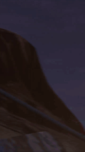 A Person In A Red Shirt Is Standing Next To A Robot With Red Lights On Its Head GIF