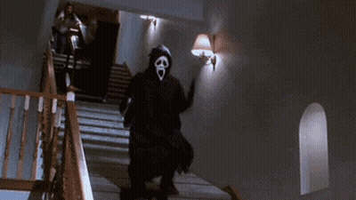 A Person In A Scream Mask Is Walking Down Stairs . GIF