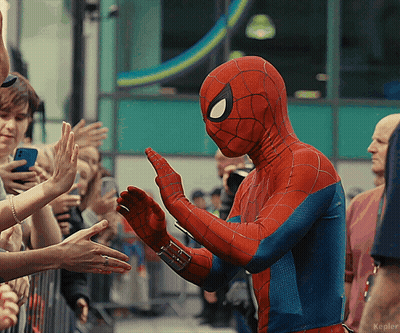 A Person In A Spiderman Costume Giving A High Five GIF