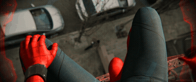 A Person In A Spiderman Costume Is Sitting On A Balcony GIF
