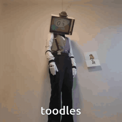 A Person In A Tv Head Costume Holding A Syringe And The Word Noodles Below Them GIF