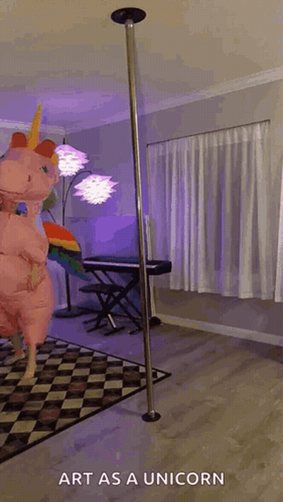 A Person In A Unicorn Costume Is Standing On A Pole . GIF