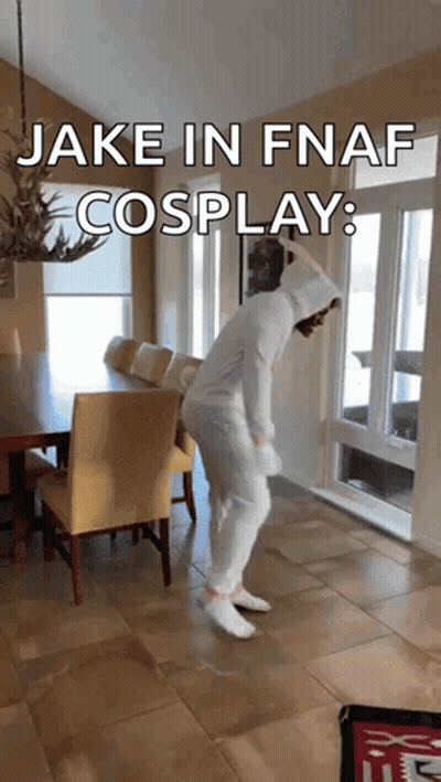 A Person In A White Costume Is Dancing In A Room With The Words " Jake In Fnaf Cosplay " On The Bottom GIF