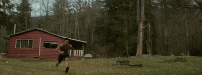 A Person In A Wolf Costume Jumping In The Air GIF