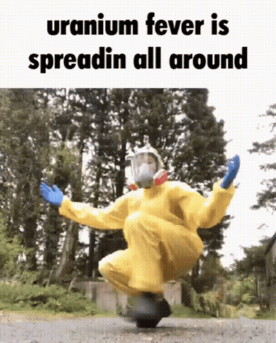 A Person In A Yellow Hazmat Suit Is Jumping In The Air With The Caption Uranium Fever Is Spreadin All Around . GIF