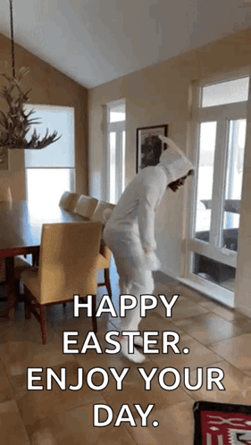 A Person In An Easter Bunny Costume Is Dancing In A Living Room With The Caption Happy Easter Enjoy Your Day GIF