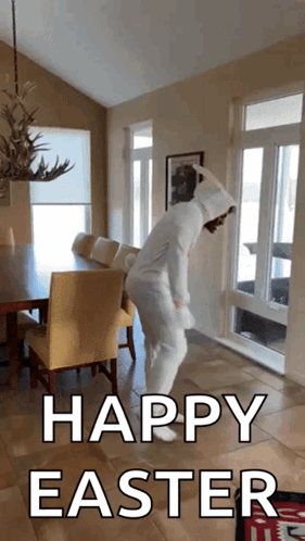 A Person In An Easter Bunny Costume Is Dancing In A Living Room With The Words Happy Easter Below Them GIF
