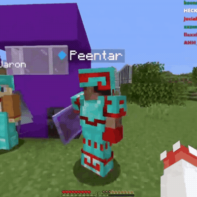 A Person In Armor Is Standing In Front Of A Purple Building In A Video Game . GIF