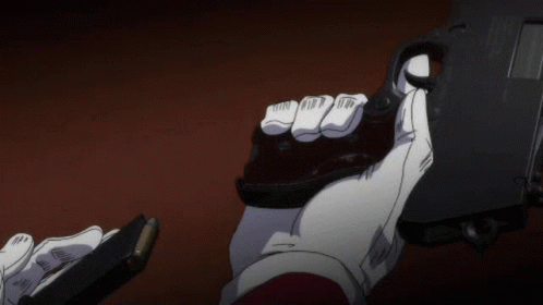 A Person In White Gloves Is Holding A Gun And A Magazine In Their Hands . GIF