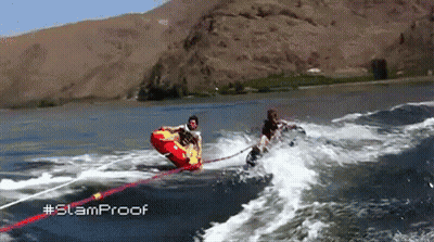 a person is being towed by a boat in the water with the hashtag slamproof
