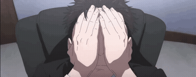 A Person Is Covering Their Face With Their Hands While Sitting In A Chair . GIF