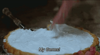 A Person Is Cutting A Pie With Whipped Cream On Top And Says `` My Germs '' . GIF