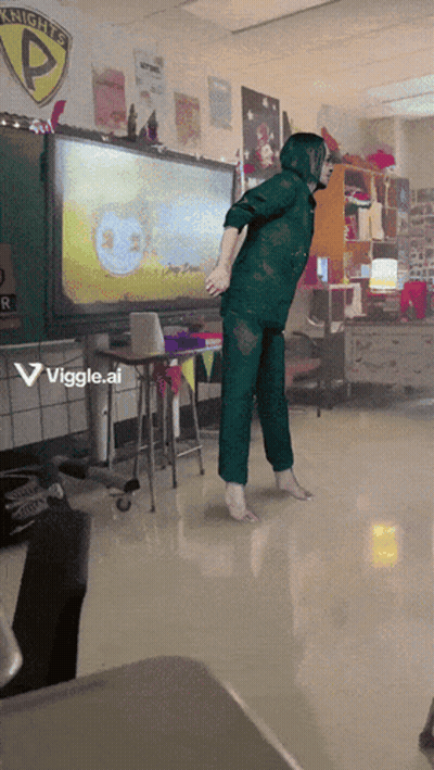 A Person Is Dancing In A Classroom With A Sign That Says Knights GIF