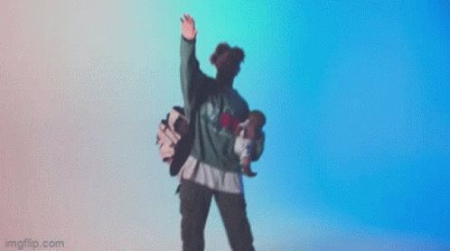 A Person Is Dancing In Front Of A Blue Background GIF