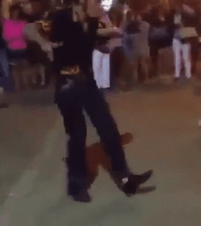 A Person Is Dancing In Front Of A Crowd GIF