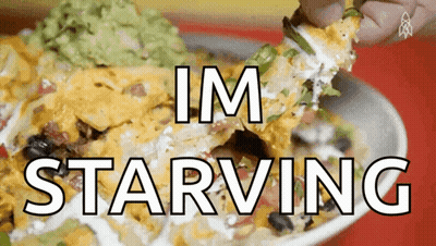 A Person Is Dipping A Nacho Into Guacamole With The Words Im Starving Below It GIF