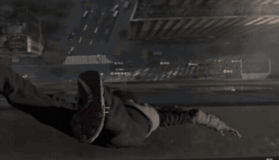 A Person Is Doing A Handstand In A Dark Area GIF