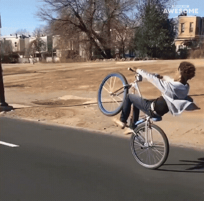 A Person Is Doing A Trick On A Bicycle With The Words Awesome Behind Them GIF