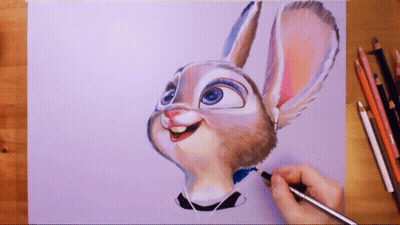 A Person Is Drawing A Bunny With A Pencil On A Piece Of Paper GIF