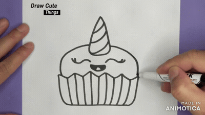 A Person Is Drawing A Cupcake With A Unicorn Horn On A Piece Of Paper GIF