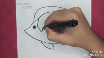 A Person Is Drawing A Fish On A Piece Of Paper With The Words Draw Cute Things On The Bottom GIF