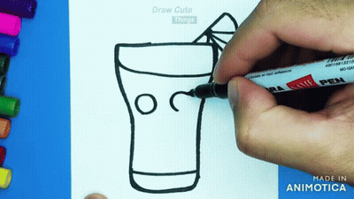 A Person Is Drawing A Glass With A Straw On A Piece Of Paper GIF