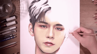 A Person Is Drawing A Man 'S Face With A Pencil On A Piece Of Paper GIF