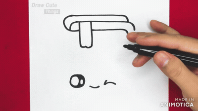 A Person Is Drawing A T On A Piece Of Paper With A Marker GIF
