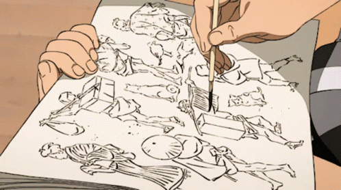 A Person Is Drawing On A Piece Of Paper With A Brush GIF