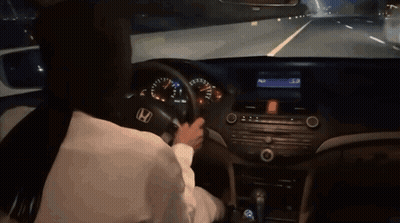 A Person Is Driving A Honda Car On A Highway GIF
