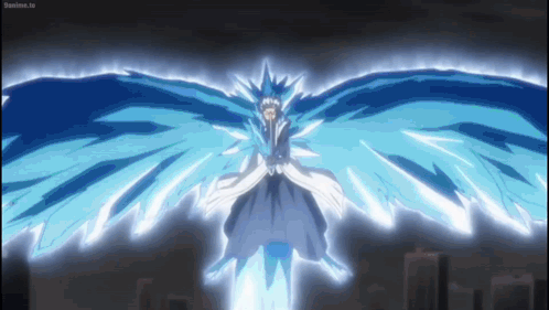A Person Is Flying Through The Air With Wings That Are Glowing In The Dark . GIF