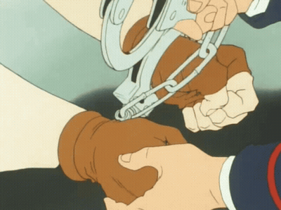 A Person Is Handcuffed To Another Person 'S Arm GIF