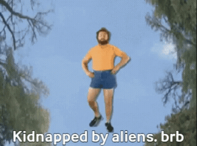 A Person Is Hanging Upside Down In The Air With The Words Kidnapped By Aliens GIF