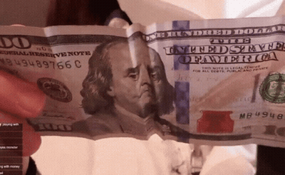 A Person Is Holding A 100 Dollar Bill With The Number Mb4948 On It GIF