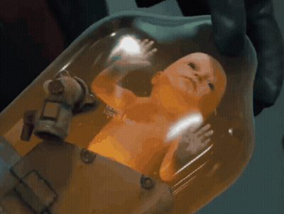 A Person Is Holding A Baby In A Container That Says ' I 'M A Robot ' On The Bottom GIF