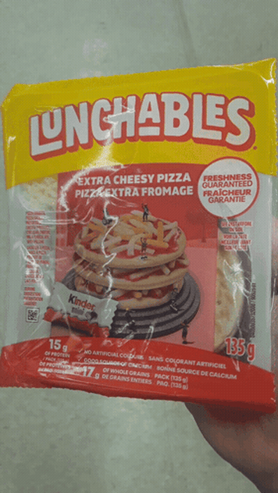 A Person Is Holding A Bag Of Lunchables Extra Cheesy Pizza GIF