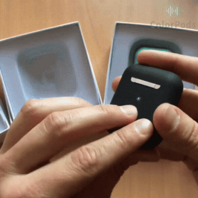 A Person Is Holding A Black Item In Front Of A Box That Says Colorpack GIF