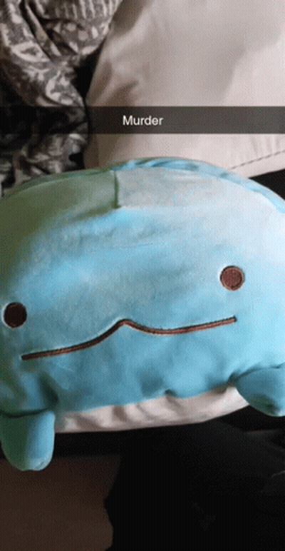 A Person Is Holding A Blue Stuffed Animal That Says Murder On It GIF