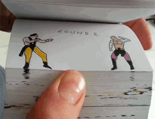 A Person Is Holding A Book Open To A Page That Says Round 2 On It GIF