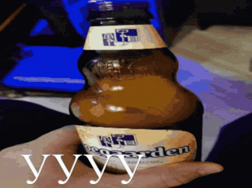 A Person Is Holding A Bottle Of Beer With The Word Yvy On It GIF