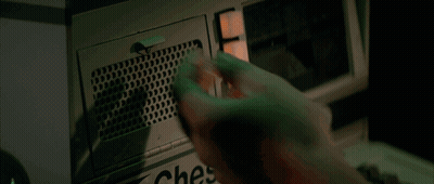 A Person Is Holding A Bottle Of Water In Front Of A Microwave Oven GIF