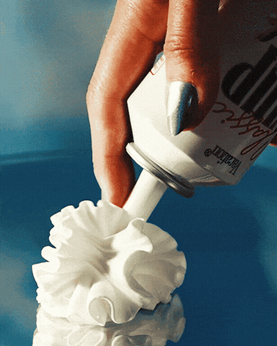 A Person Is Holding A Bottle That Says ' Heather ' On The Label GIF