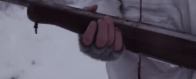 A Person Is Holding A Bow And Arrow In Their Hand . GIF