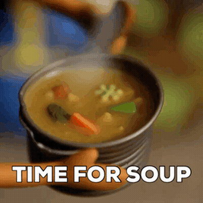 A Person Is Holding A Bowl Of Soup With The Words Time For Soup Above It . GIF